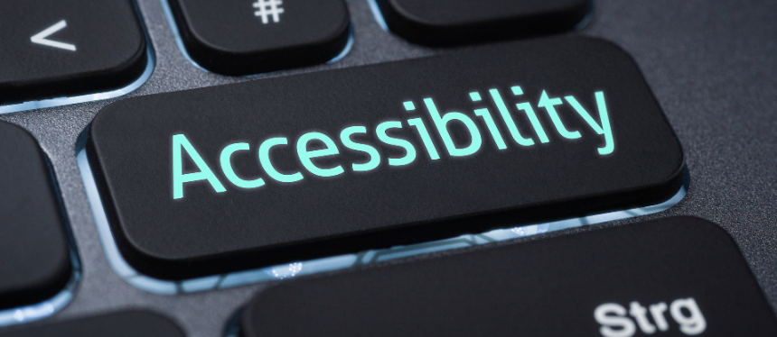 A close-up shot of a black computer keyboard focusing on a single custom key that glows with light-blue text reading "Accessibility."