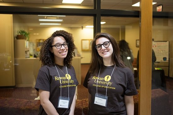 two students standing in front of the advising center