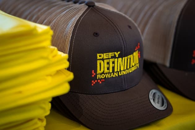 A hat with the label defy definition on it.